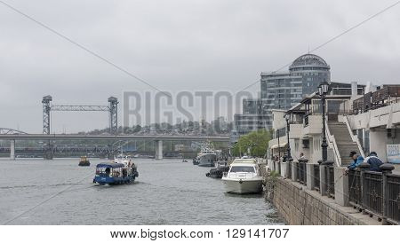 ROSTOV-ON-DON RUSSIA- MAY 0: By the Don River are going ships. From waterfront fishermen catch fish on May 01 2015 in Rostov-on-Don