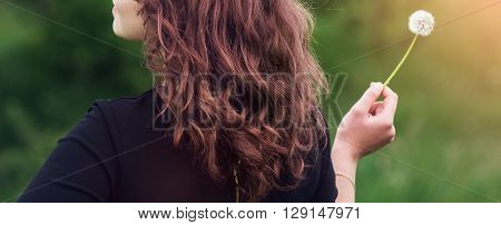 Girl With A Dandelion In The Hand