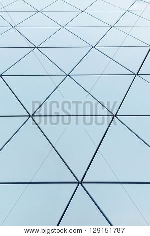 Abstract close-up view of modern aluminum ventilated facade of triangles