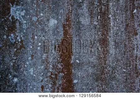 Dirty wall that have dark white and brown color.