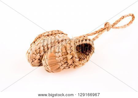 Pair of footware made of straw on white background