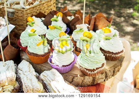 a lot of spongecake or muffin with cream on candy bar