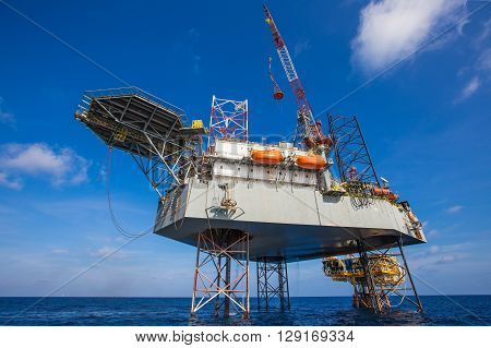 Oil and gas drilling rig just completion on oil and gas wellhead platform