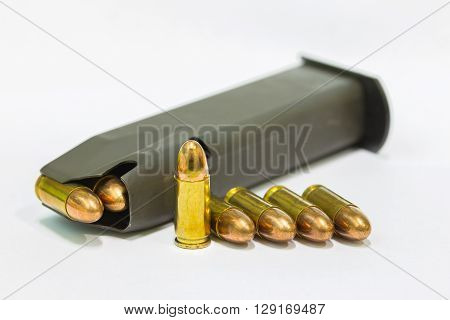 9mm. practice bullets with magazine on white background