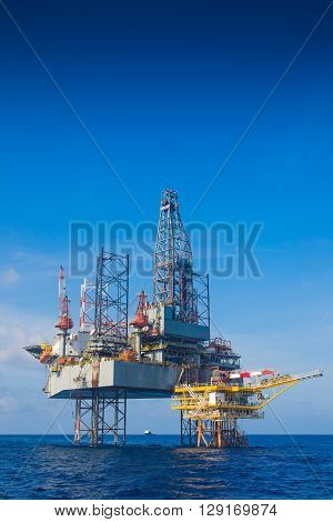 Oil and gas drilling rig just completion on oil and gas wellhead platform