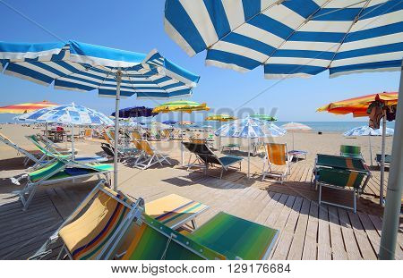 Shade Of The Umbrellas On The Beach Of The Tourist Village By The Sea In Summer