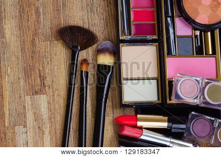 set of  black brushes, lipsticks, maskara and  eye shadows