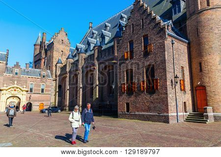 Gouda Netherlands - April 20 2016: The Waag with unidentified people. It was built in 1667 and was used for weighing goods especially cheese to levy taxes. It now is a national monument