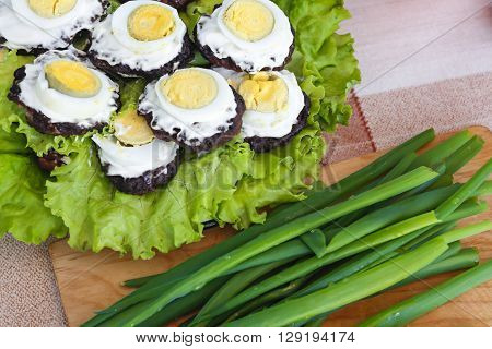 Fresh healthy salad on wooden table. Top view.the salad on the tablegreen onion