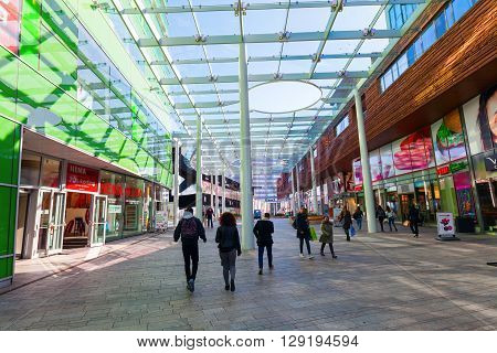 Almere Netherlands - April 19 2016: ceiled pedestrian area with unidentified people in Almere that is a fast planned city. With a population of about 200000 it is the 7th largest Dutch city