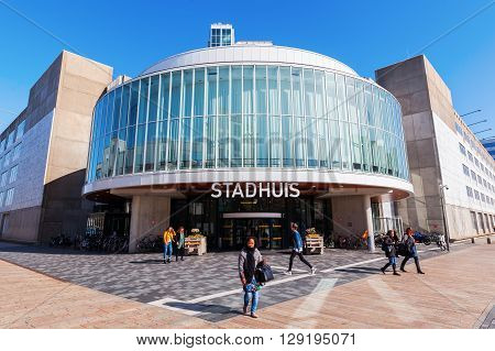 Almere Netherlands - April 19 2016: city hall of Almere with unidentified people. Almere is a fast growing planned city. With a population of about 200000 it is the 7th largest Dutch city