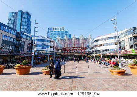 Almere Netherlands - April 19 2016: railway station of Almere with unidentified people. Almere is a fast growing planned city. With a population of about 200000 it is the 7th largest Dutch city