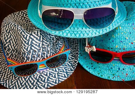 Preparation for traveltrip vacation tourism mock up of road map camerahat sunglasses on wooden table.