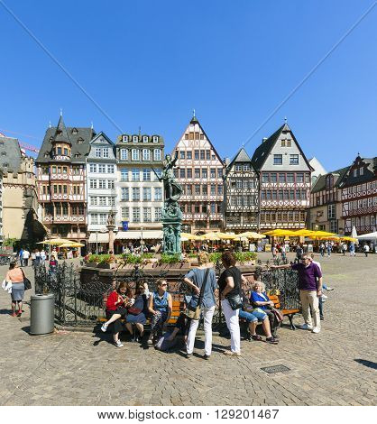 People Visit Romerberg (romerplatz) With Old Buildings  In Frankfurt