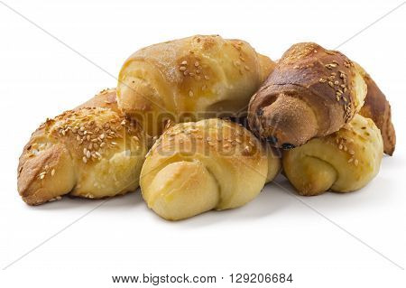 Fresh Serbian pastry rolls with cheese and sesame, kifla, kiflice, isolated on white background
