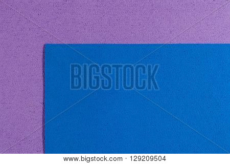 Eva foam ethylene vinyl acetate blue surface on light purple sponge plush background