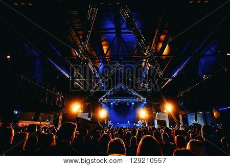 night party festival crowd of people silhouettes hands up
