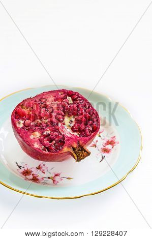 Fresh and ripe red pomegranate macro shot