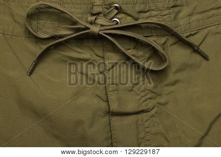 close fly green jeans texture background closeup