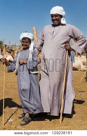 DARAW, EGYPT - FEBRUARY 6, 2016: Local camel salesmen on Camel market posing for camera.