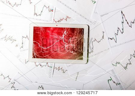 Forex trading background concept with tablet and red screen