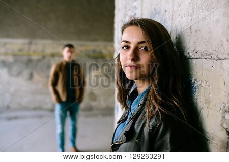 handsome guy and beautiful girl posing in a bystreet
