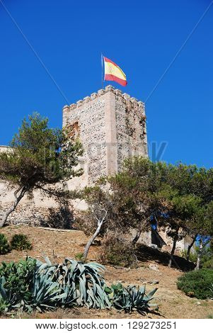 FUENGIROLA, SPAIN - JUNE 21, 2008 - View of Sohail castle with a Spanish flag on one of the towers Fuengirola Malaga Province Andalucia Spain Western Europe, June 21, 2008.