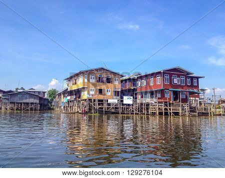 SHAN MYANMAR - MAY 26 : Traditional floating village houses in Inle Lake Myanmar on May 26 2014. Inle Lake is a freshwater lake located in the Nyaungshwe Township of Taunggyi District of Shan State part of Shan Hills in Myanmar.