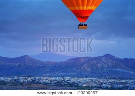 Balloon silhouette in the sunrise sky. Cappadocia, Turkey