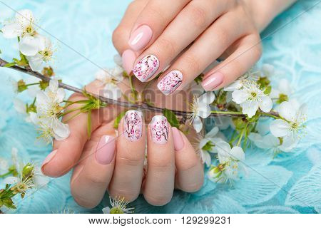 Spring manicure for the bride in gentle tones with flowers. Nail Design.