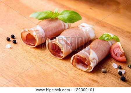 Black forest ham on wooden cutting board
