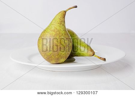 Two pears on white plate