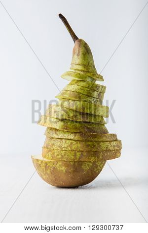 Sliced pear on white background