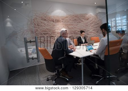 business people group brainstorming on meeting and businessman presenting ideas and projects oon laptop and tablet computer