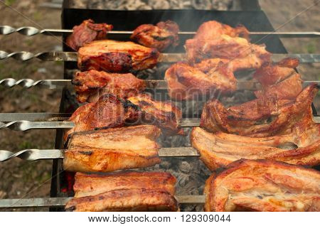 BBQ outdoors in the shade of the trees and in the fresh air. Bon appetit.