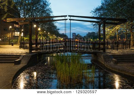 Wooden path bridge over London Albion Channel linking to Surrey Water