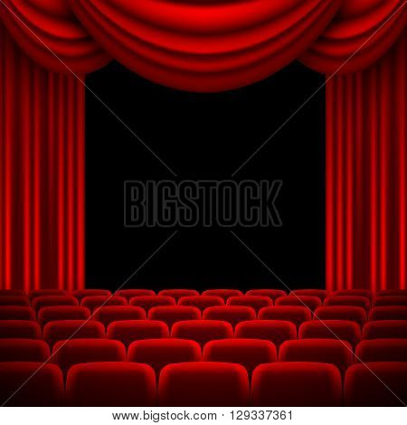 an auditorium with a seating area and a red curtain