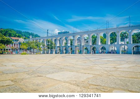 Landmark White Arches Of Arcos Da Lapa Under Bright Blue Skies In Centro Of Rio De Janeiro Brazil