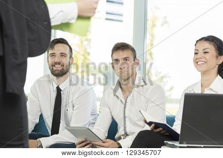 Young successful business man presenting the results of the latest project he has been workng on to his colleagues in the audience
** Note: Soft Focus at 100%, best at smaller sizes