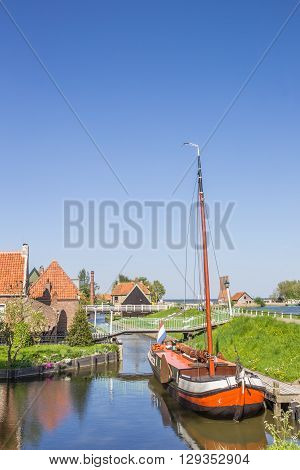 Old sailing ship in a canal in Enkhuizen Netherlands