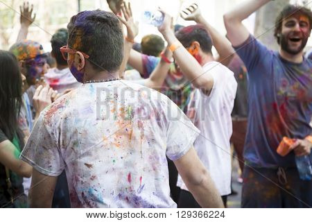 NEW YORK - APR 30 2016: People celebrating Holi Hai Festival of Colors with colorful powder on their faces in Dag Hammerskjold Plaza hosted by NYC Bhangra in New York on April 30, 2016.