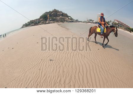 PRACHUAP KHIRI KHAN,THAILAND-MAY 7,2016 : People riding walking on Hua Hin beach on relaxing , Hua Hin Beach, Pra Chuap Khi Ri Khun Province in Middle of Thailand.