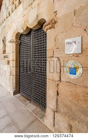 Crato, Portugal. April 4, 2015: Entrance of the Pousadas de Portugal Historical Hotel in the medieval Flor da Rosa Monastery. Belongs to the Historical Hotels of Europe organization.