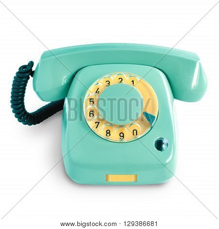 Vintage green telephone with rotary dial isolated on white background