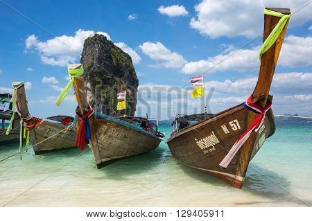 CRABI PROVINCE THAILAND - FEBRUARY 02 2015: Traditional thai long tail boats waiting for tourists to travel to beautiful islands in Thailand