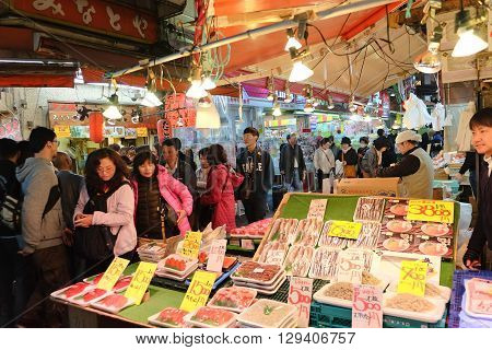 TOKYO- APRIL 1, 2016: Fish shop in Ameyoko Street in Ueno district ,Tokyo Japan, This market is various products such as clothes, bags, cosmetics, fresh fish, dried food and spices are sold along Ameyoko.