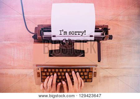 The sentence I am sorry against white background against above view of old typewriter