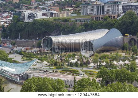 Tbilisi, Georgia - May 07, 2016: People In Apark In Front Of Concert Hall And The Official Residence