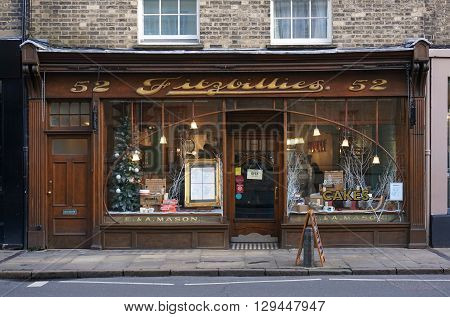 CAMBRIDGE, UK - DECEMBER 23: People sit inside the well-known Fitzbillies, a traditional bakery and cafe on Trumpington Street in Cambridge, England on December 23, 2015.