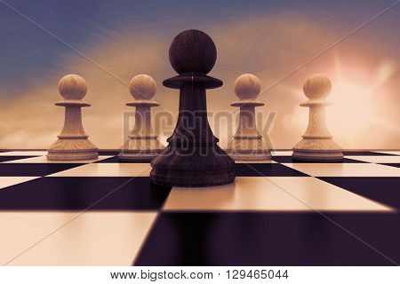 Black pawn in front of white pawns against blue sky with white clouds